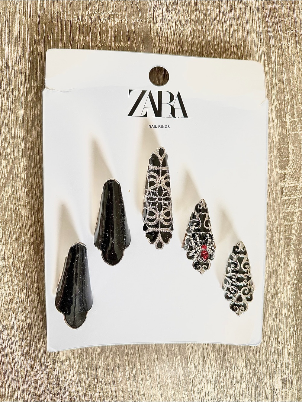 Ornate Nail Rings with Red Accent